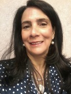 woman with long brown hair smiling 