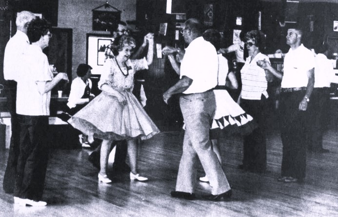 A square dance group performs.